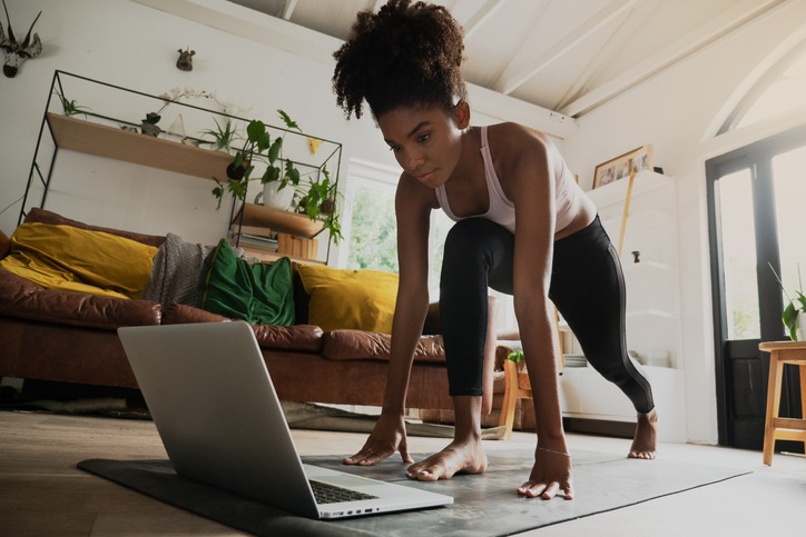 woman doing a home workout from laptop