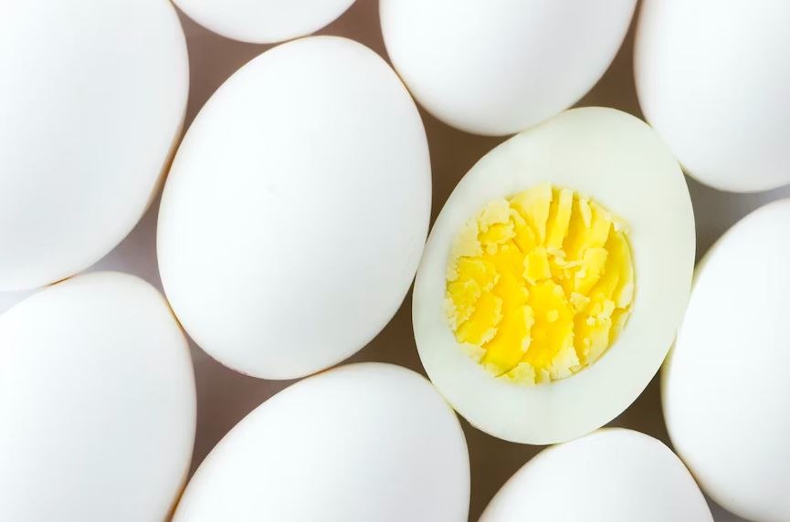 white eggs on brown wooden table