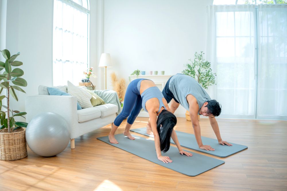Asian family stay at home together on holiday. Love couple lifestyle. Yoga and exercise concept