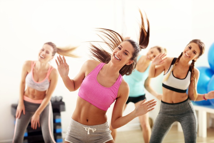 group of happy people exercising