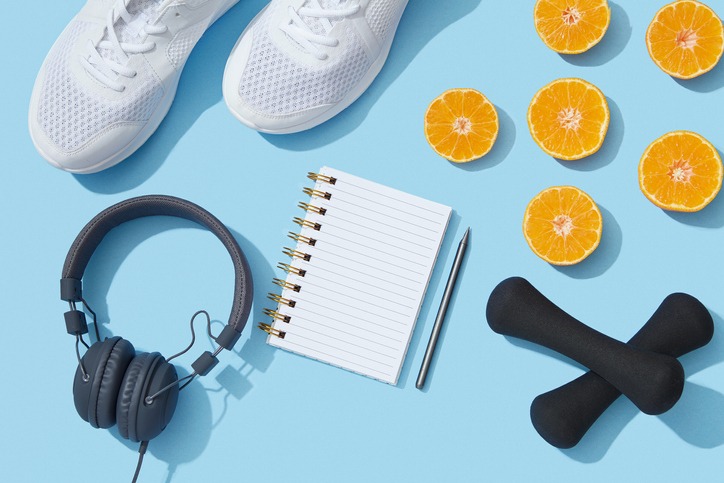 sports accessories, notebook and oranges